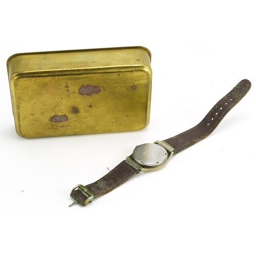 836 - British military World War I brass Mary tin and a military issue wristwatch with screw back impresse... 