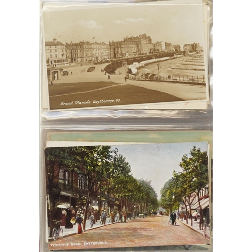 758 - Collection of nearly one hundred Eastbourne postcards arranged in an album including Grand Parade, T... 