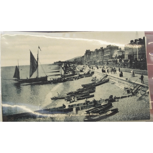 758 - Collection of nearly one hundred Eastbourne postcards arranged in an album including Grand Parade, T... 