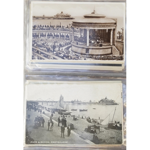 758 - Collection of nearly one hundred Eastbourne postcards arranged in an album including Grand Parade, T... 