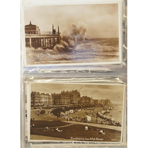 758 - Collection of nearly one hundred Eastbourne postcards arranged in an album including Grand Parade, T... 