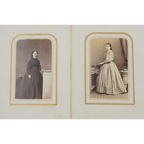 754 - Collection of Victorian photographs, cabinet cards and cartes de visite arranged in three albums inc... 