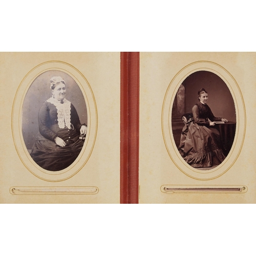 754 - Collection of Victorian photographs, cabinet cards and cartes de visite arranged in three albums inc... 