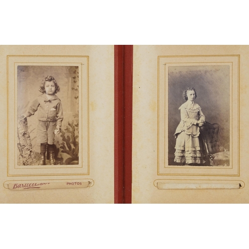 754 - Collection of Victorian photographs, cabinet cards and cartes de visite arranged in three albums inc... 