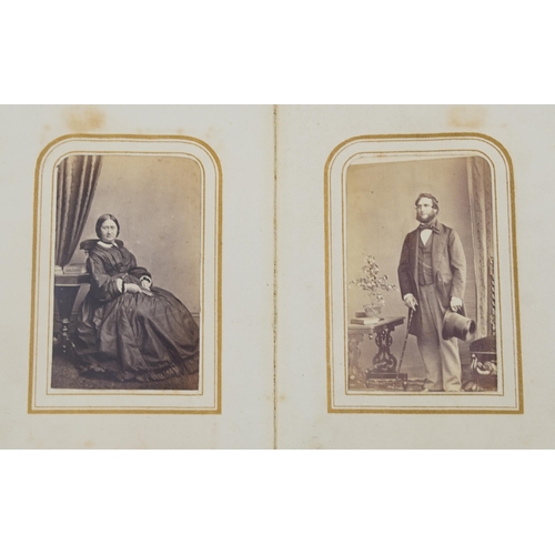 754 - Collection of Victorian photographs, cabinet cards and cartes de visite arranged in three albums inc... 