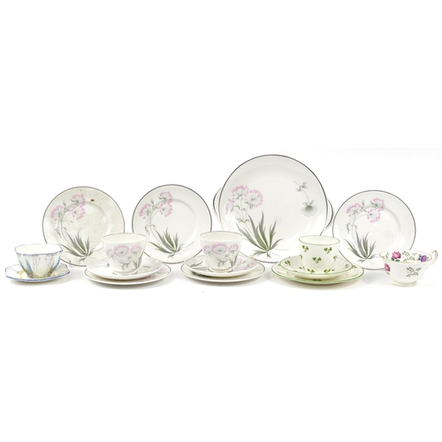 1349 - Collection of Shelley Art Deco porcelain teaware including trios, sugar bowl and cake plate, the lar... 