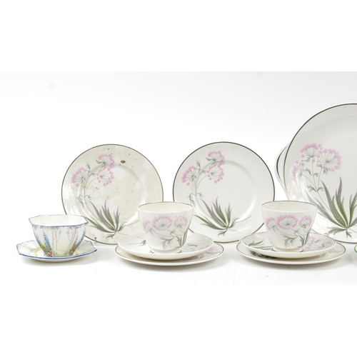 1349 - Collection of Shelley Art Deco porcelain teaware including trios, sugar bowl and cake plate, the lar... 