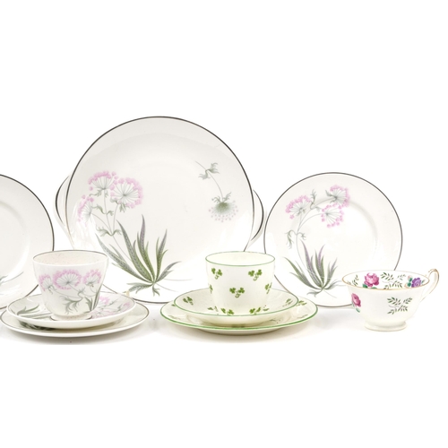 1349 - Collection of Shelley Art Deco porcelain teaware including trios, sugar bowl and cake plate, the lar... 