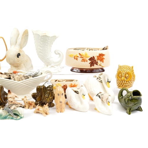 1446 - Collection of vintage Sylvac porcelain including vases, teapot, money boxes and swan vases, the larg... 