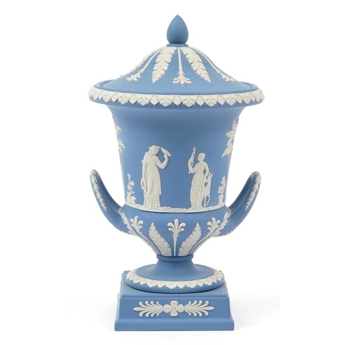 183 - Wedgwood Jasperware campana urn vase and cover with twin handles decorated in low relief with a cont... 