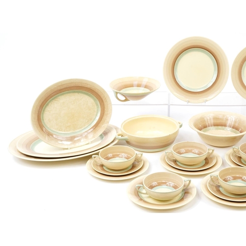 248 - Susie Cooper, Art Deco dinnerware including lidded tureen, plate and graduated meat platters, the la... 