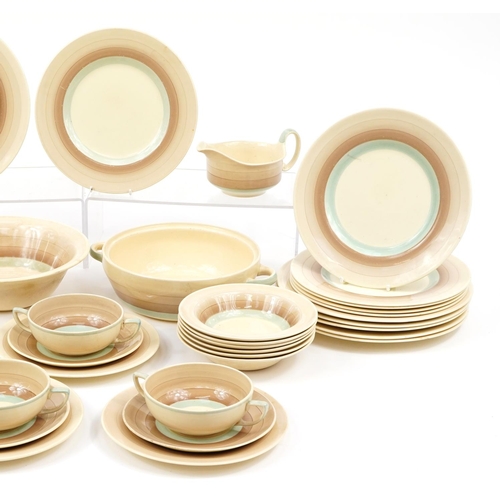 248 - Susie Cooper, Art Deco dinnerware including lidded tureen, plate and graduated meat platters, the la... 