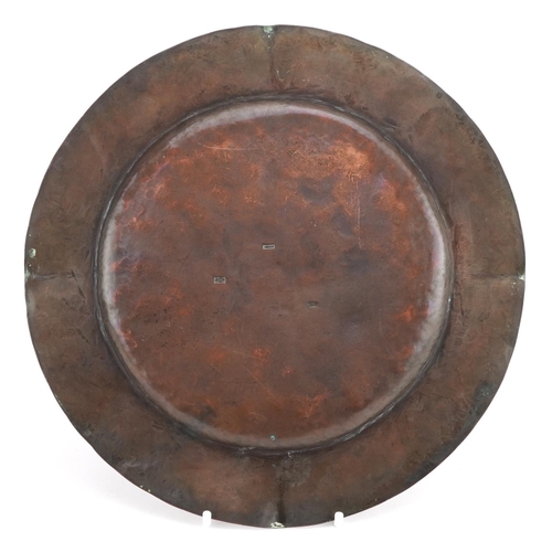 308 - Iona, Arts & Crafts copper dish with applied silver medallions, 23cm in diameter