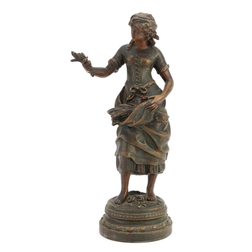 1381 - Classical patinated spelter figure of a female holding wheat, 31cm high