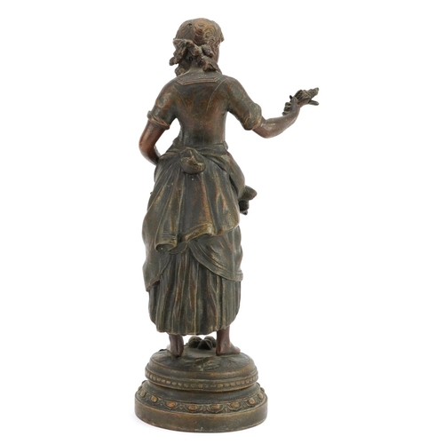 1381 - Classical patinated spelter figure of a female holding wheat, 31cm high