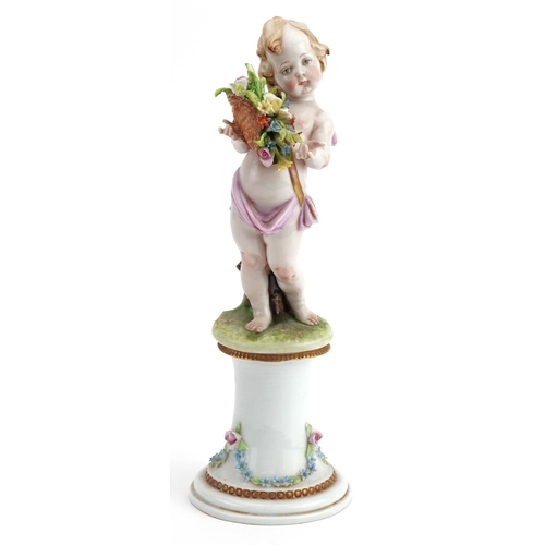 277 - Italian Naples porcelain centrepiece in the form of Putti standing on a pillar surrounded by a porce... 