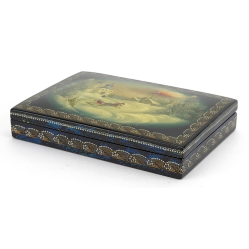 1432 - Russian lacquered card box having a hinged lid hand painted with a Cossack, 15cm wide