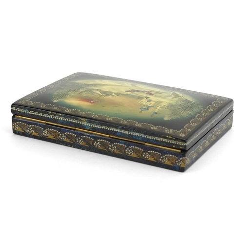 1432 - Russian lacquered card box having a hinged lid hand painted with a Cossack, 15cm wide