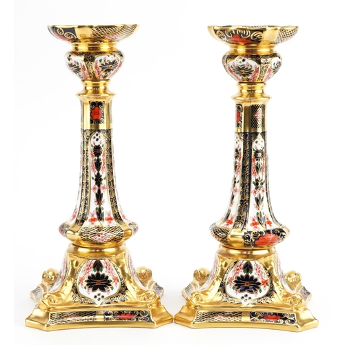 185 - Pair of Royal Crown Derby Old Imari pattern candlesticks numbered 1128, each 27cm high