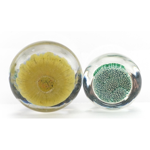 1357 - Two millefiori glass paperweights, the largest 6.5cm in diameter