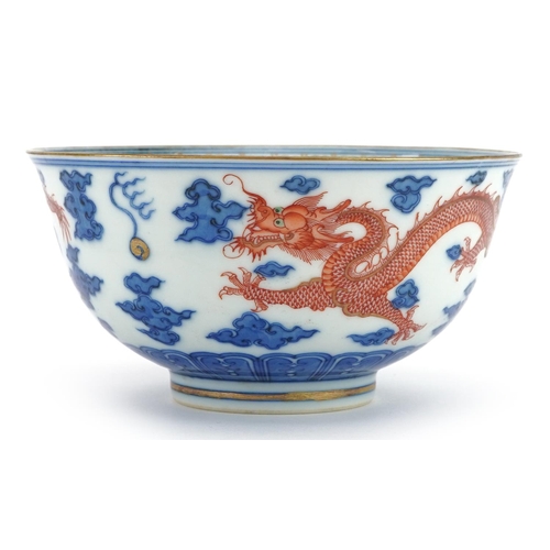 67 - Chinese blue and white with iron red porcelain bowl hand painted with two dragons chasing the flamin... 