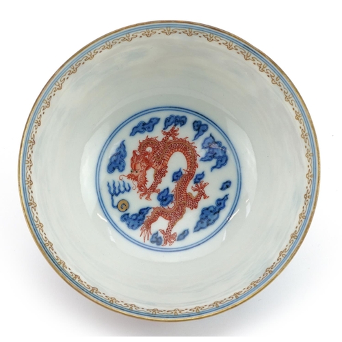 67 - Chinese blue and white with iron red porcelain bowl hand painted with two dragons chasing the flamin... 