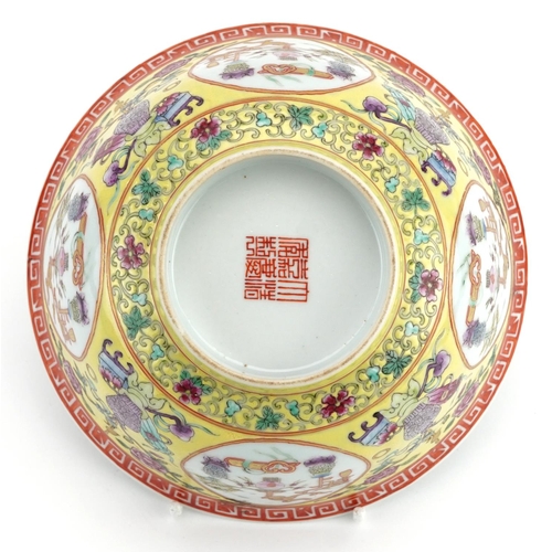 147 - Chinese porcelain yellow ground bowl hand painted in the famille rose palette with panels of lucky o... 