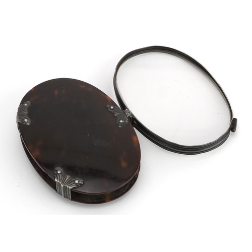 54 - 19th century unmarked silver and tortoiseshell folding magnifying glass, 8cm wide