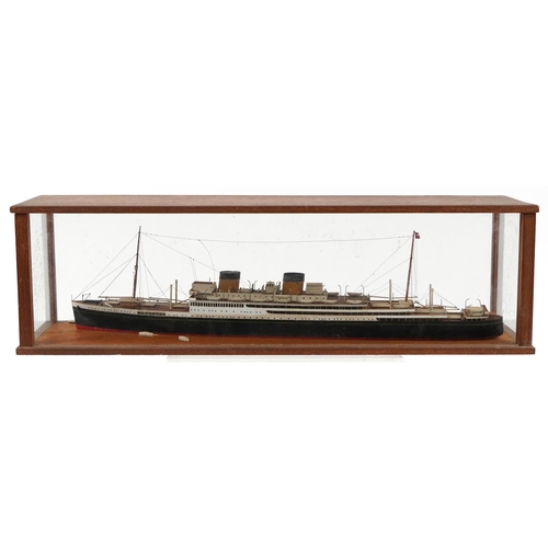 289 - Hand painted scratch built model of an ocean liner housed in a glazed oak display case, overall 64cm... 