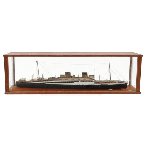 289 - Hand painted scratch built model of an ocean liner housed in a glazed oak display case, overall 64cm... 