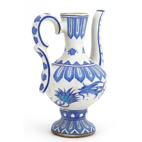 226 - Turkish Ottoman pottery ewer hand painted with flowers, 20.5cm high