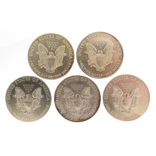 646 - Five United States of America one ounce silver dollars comprising dates 1986, 1994, 2014, 2014 and 2... 