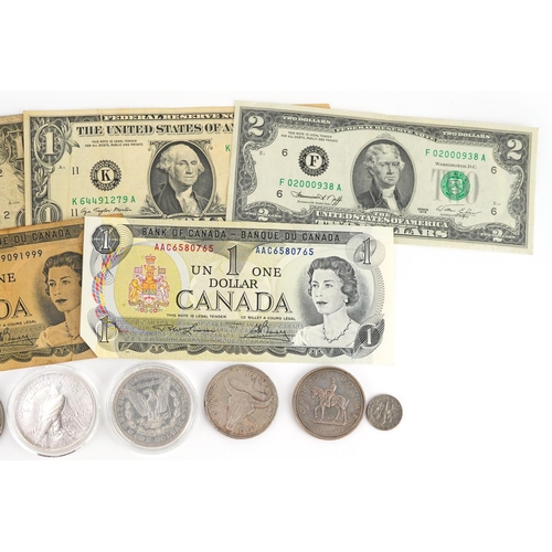 651 - American and Canadian coinage and banknotes, some silver including 1886 Morgan Dollar, 1922 Liberty ... 