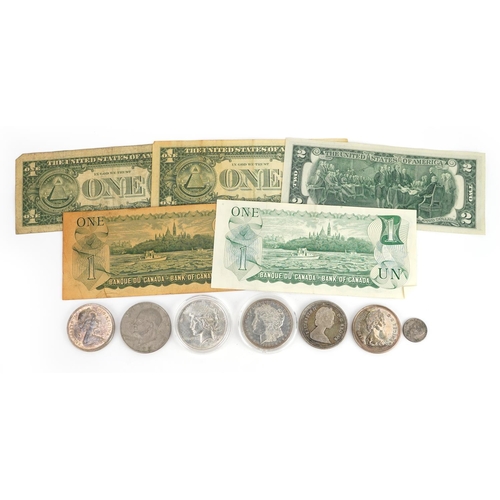 651 - American and Canadian coinage and banknotes, some silver including 1886 Morgan Dollar, 1922 Liberty ... 