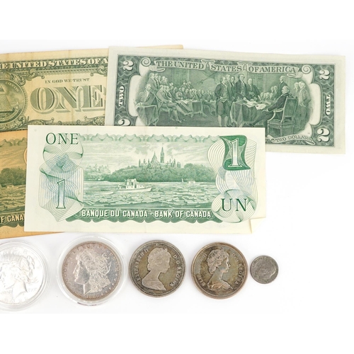 651 - American and Canadian coinage and banknotes, some silver including 1886 Morgan Dollar, 1922 Liberty ... 