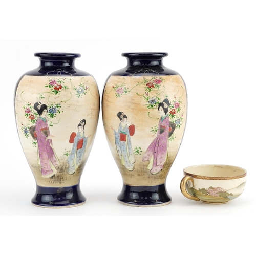 1282 - Pair of Japanese Satsuma pottery vases and a cup hand painted with figures in a landscape, the vases... 