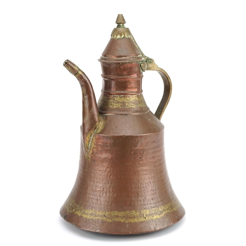 1383 - Omani copper and brass spouted vessel, 35cm high