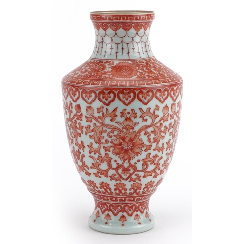 13 - Chinese porcelain vase hand painted in iron red with flower heads amongst scrolling foliage within r... 