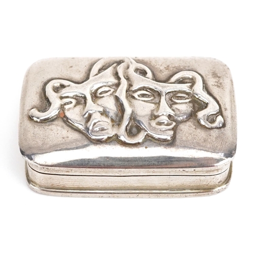 319 - Ari D Norman, Elizabeth II silver pillbox embossed with two theatrical masks, London 1991, 4cm wide,... 