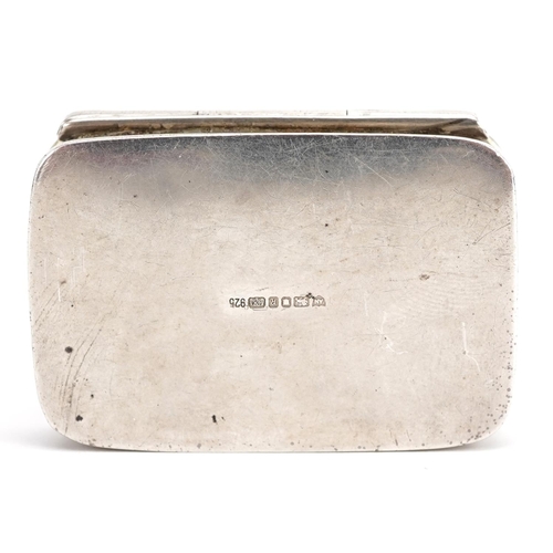 319 - Ari D Norman, Elizabeth II silver pillbox embossed with two theatrical masks, London 1991, 4cm wide,... 