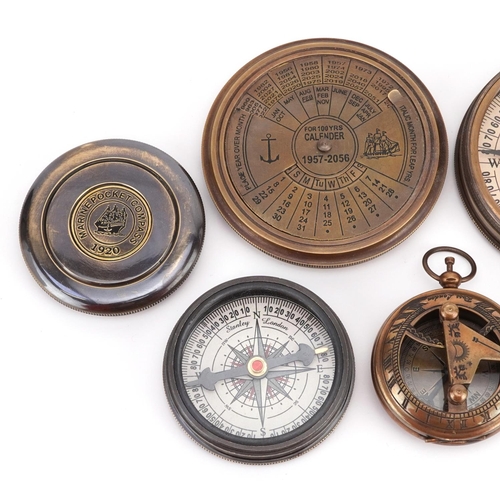 1300 - Four nautical interest compasses, one with perpetual calendar, the largest 7.5cm in diameter