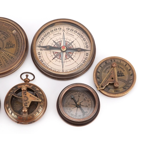 1300 - Four nautical interest compasses, one with perpetual calendar, the largest 7.5cm in diameter