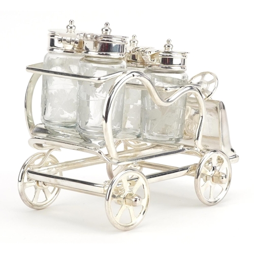 297 - Novelty silver plated four piece cruet in the form of a car, 15.5cm in length