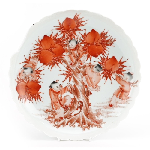 331 - Chinese porcelain shallow dish hand painted in iron red with children amongst peaches, character mar... 