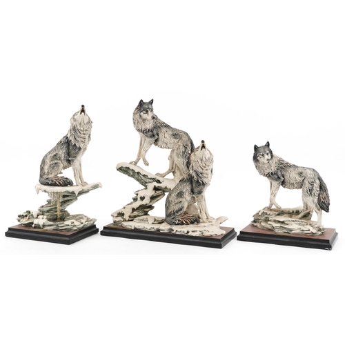 1294 - Giuseppe Armani for Nocturne, three large wolf groups raised on simulated burr wood bases, the large... 