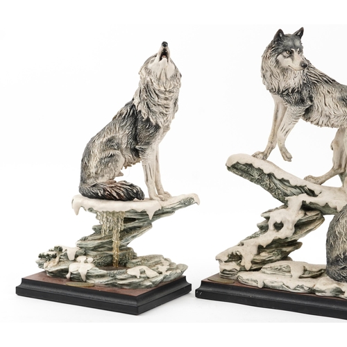 1294 - Giuseppe Armani for Nocturne, three large wolf groups raised on simulated burr wood bases, the large... 