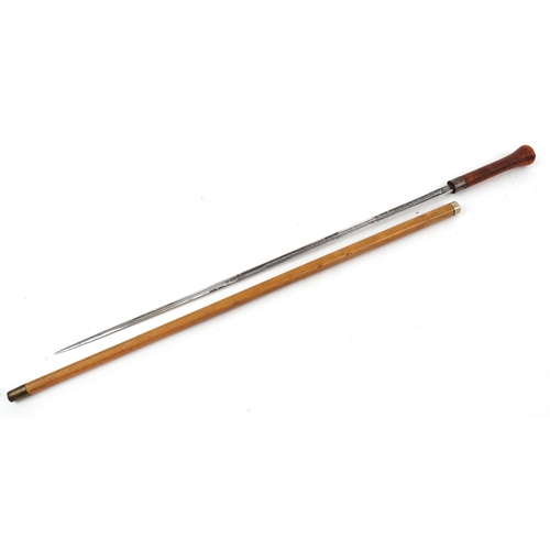 117 - Malacca walking swordstick by Wilkinson of Pall Mall with engraved steel blade, 86cm in length