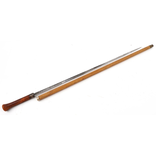 117 - Malacca walking swordstick by Wilkinson of Pall Mall with engraved steel blade, 86cm in length