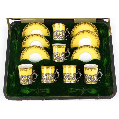 182 - Set of six Copeland Spode coffee cans with saucers having silver Putti design cup holders with griff... 