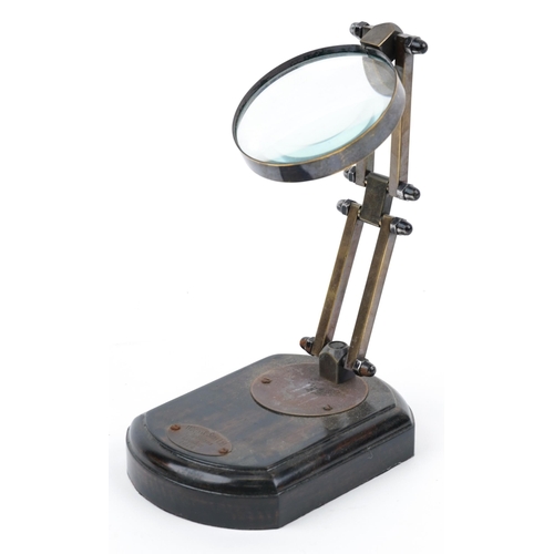 1288 - Adjustable brass desk top magnifying glass with wooden plinth base, 19cm high fully extended